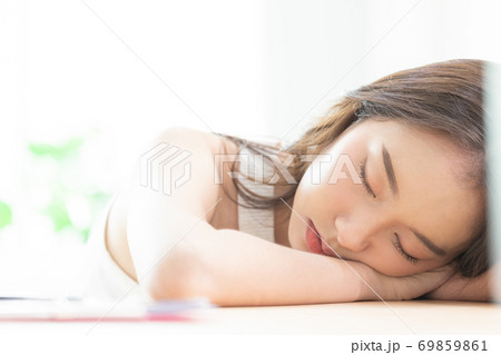 Asian women sleeping and sweet dream on white bed in bedroom Asian women sleeping and sweet dream on white bed in bedroom 69859861