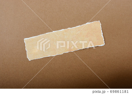 Grungy torn paper with space for text on another paper 69861181