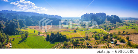 Aerial view of Limestone mountain and rice field Aerial view of Limestone mountain and rice field 69861680