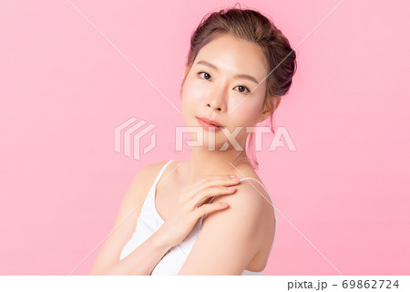 Beautiful young asian woman with clean fresh skin on pink background, Face care, Facial treatment, 69862724