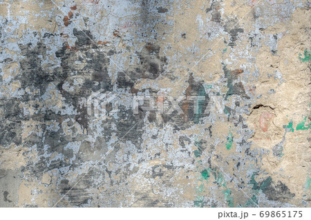 Texture, background of the old wall and with damaged cladding Texture, background of the old wall and with damaged cladding 69865175