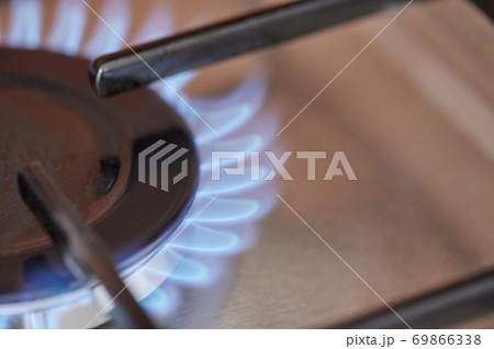 Blue gas stove fire macro close up view 69866338
