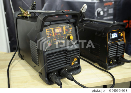 At the workshop. DC inverter MMA welder, household electric welding machine, placed on the table 69866463