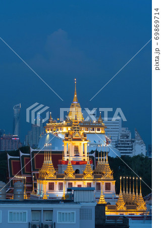 Loha Prasat Wat Ratchanatda and Golden Mountain pagoda, a buddhist temple or Wat Saket with skyscraper buildings in Bangkok Downtown, urban city, Thailand. Thai Landmark. Architecture. 69869714