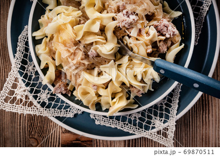Pasta with sauerkraut and meat. 69870511