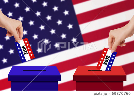 Hand holding and putting voting paper card in ballot voting box with USA flag in background. 69870760