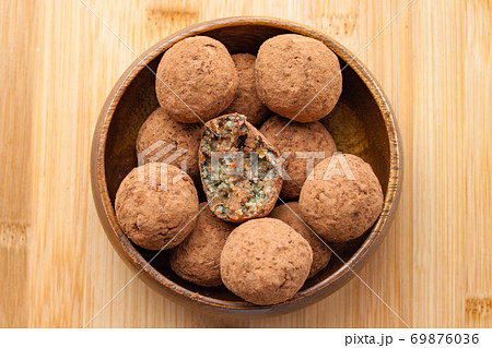 Homemade handmade sweet candy balls in cocoa Homemade handmade sweet candy balls in cocoa 69876036