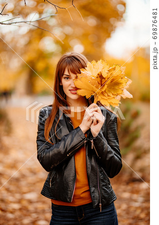 beautiful woman with a of yellow maple leaves beautiful woman with a of yellow maple leaves 69876481