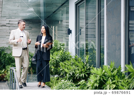 Talking business people Talking business people 69876691