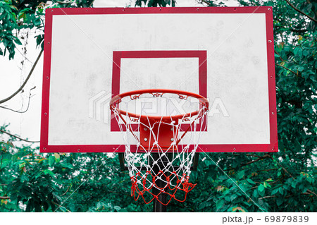 Basket ball net on a green natural background Basket ball net on a green natural background 69879839