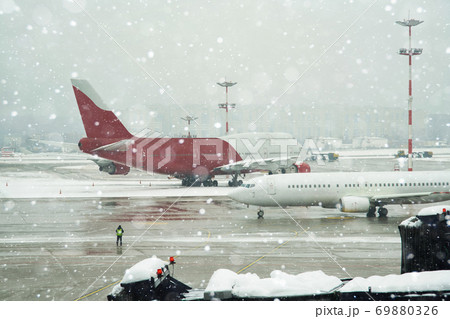 Airport under snowfall 69880326
