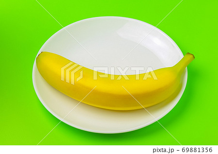 banana on a green background close-up. isolate banana on a green background close-up. isolate 69881356
