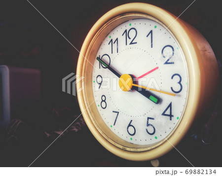 alarm clock - A vintage alarmclock in a faded background with copy space alarm clock - A vintage alarmclock in a faded background with copy space 69882134