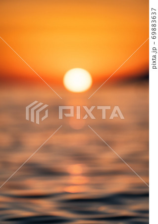 Waves on the sea surface and sky as a background. Blured landscape. Seascape during sunset Waves on the sea surface and sky as a background. Blured landscape. Seascape during sunset 69883637