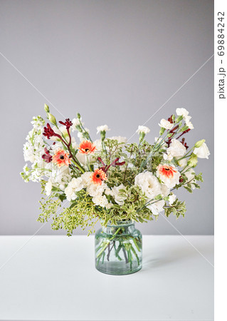 Bouquet 003. Sekective focus on flowers. Series, step by step installation of flowers in a vase. Flowers bunch, set for home. Delivery fresh cut flower. 69884242