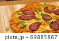 Appetizing hot pepperoni pizza lies on a tray. Appetizing hot pepperoni pizza lies on a tray. Close 69885867