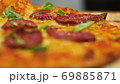 ppetizing hot pepperoni pizza lies on a tray. Close-up. Slow motion 69885871