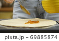 Cooking pizza. The chef prepares the pizza dough. A man or woman is engaged in home business 69885874