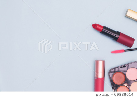 set of professional cosmetics, makeup tools and accessories on blue background, concept of beauty, fashion, shopping, flat lay set of professional cosmetics, makeup tools and accessories on blue background, concept of beauty, fashion, shopping, flat lay 69889614