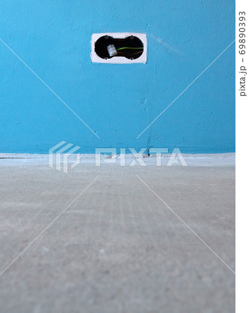 House under construction, euro power socket placed in a wall 69890393