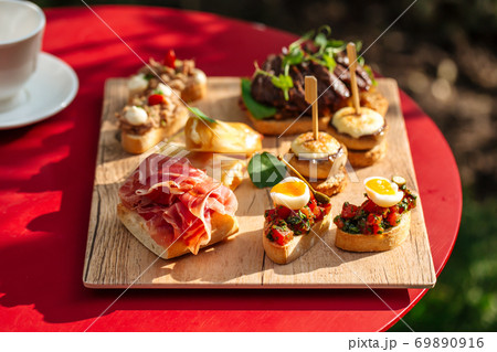 Assorted spanish tapas with different toppings Assorted spanish tapas with different toppings 69890916