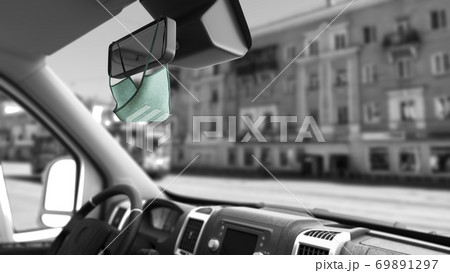 mask on the rearview mirror inside the car safe passenger transportation concept Taxi 3d render on white background 69891297