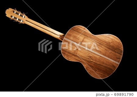 Isolated image of back of an acoustic guitar Isolated image of back of an acoustic guitar 69891790