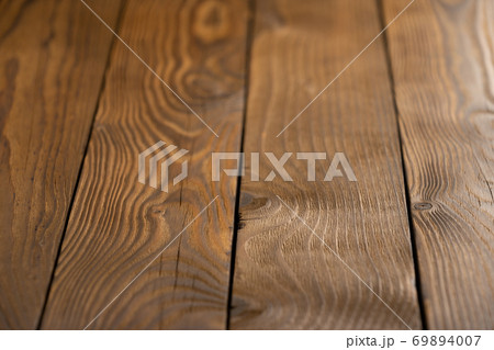 Old wooden plank background with selective focus. 69894007