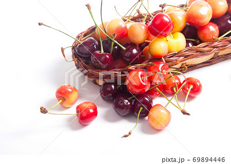 Yellow and red sweet cherry in basket isolate on white. 69894446
