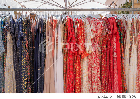 Dresses on coat rack on sale at street market in Aix-en-Provence, France Dresses on coat rack on sale at street market in Aix-en-Provence, France 69894806