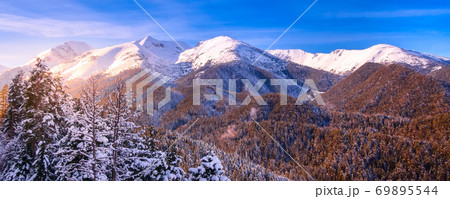 colorful sunset in snow mountains forest colorful sunset in snow mountains forest 69895544