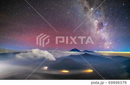 Bromo volcano with milky way, the moon and sand strom Tengger Semeru national park, East Java, Indonesia 69896376