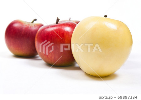 Group of ripe apples on a white background Group of ripe apples on a white background 69897334
