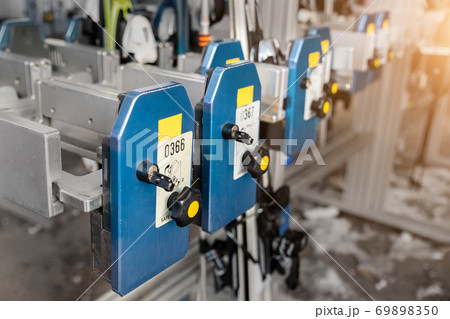 Many ski snowboard storage locker coin cells at peak entrance of station of cabin gondola ski lift at mountain alpine luxury austrian winter resort. Comfort service and facilities for tourists skiers 69898350