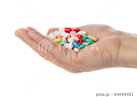 Hand with pills Hand with pills 69899081