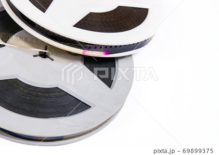 Close up view of old cine film strip isolated on white background. 69899375