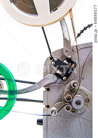 Close up view of retro motion picture film projector isolated on a white background. 69899377