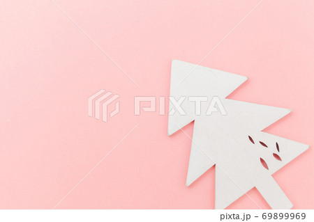 Simply minimal composition winter objects ornament fir tree isolated on pink pastel trendy background 69899969