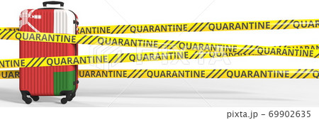 Flag of Oman on a suitcase and quarantine stripes, coronavirus pandemic tourism restrictions concept. 3d rendering 69902635