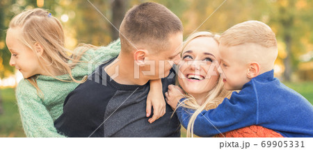 Portrait of young family in autumn park 69905331