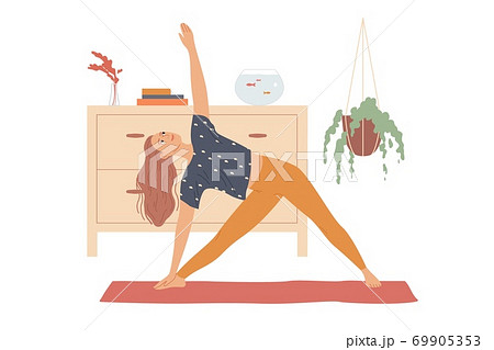 Woman performs yoga exercises by bending to the side and raising her hand - a triangle pose, three corners or Trikonasana. 69905353