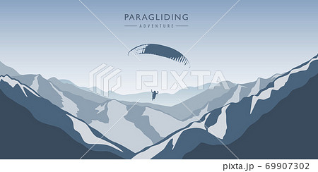 paragliding adventure in blue snowy mountains winter landscape 69907302