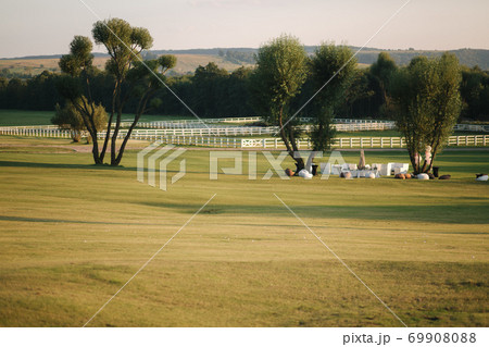Golf course in cuntryside. Sun set in summer evening 69908088