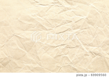 Crumpled brown paper background texture Crumpled brown paper background texture 69909560