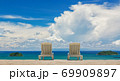 Couple of beach beds on tropical beach with beautyful blue sky 69909897