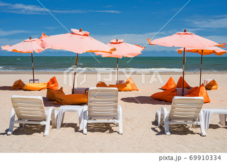 summer beach with chair. relax seat, parasol 69910334