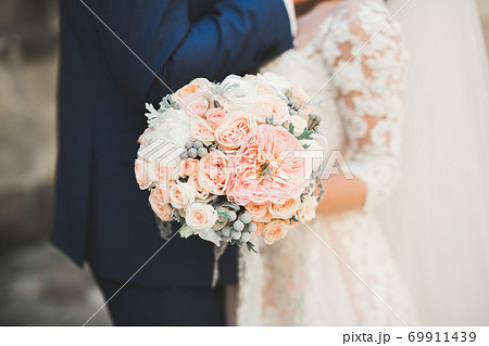 Beautiful wedding bouquet with different flowers, roses 69911439