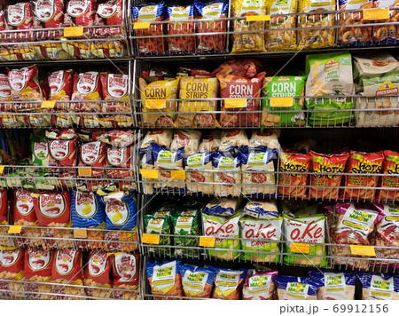KUALA LUMPUR, MALAYSIA -JUNE 01, 2020: Variety of biscuits in good and interesting packaging and displayed on the racks inside the shop. Sort by brand and type to make it easier for customers to buy. KUALA LUMPUR, MALAYSIA -JUNE 01, 2020: Variety of biscuits in good and interesting packaging and displayed on the racks inside the shop. Sort by brand and type to make it easier for customers to buy. 69912156