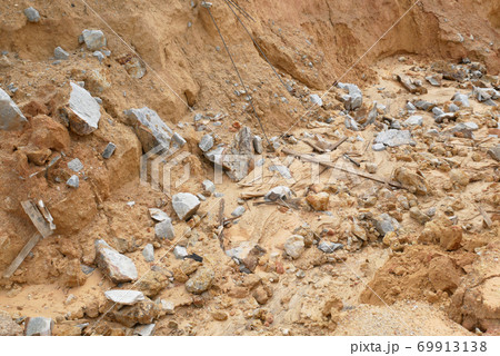 Erosion at ground and slopes is caused by rainfall. The soil structure is weak and there is a landslide. Safety measure has been taken in some area. 69913138