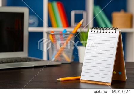 Blank open notepad with copy space on office table Blank open notepad with copy space on office table 69913224